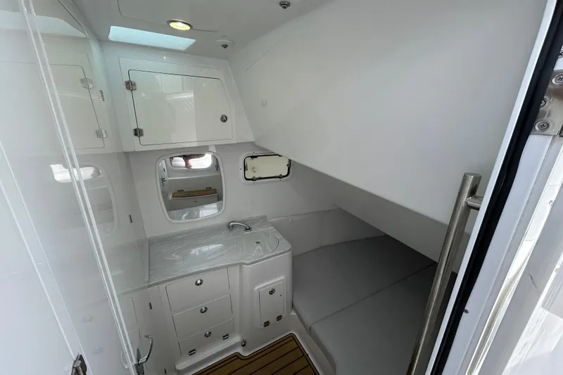  Yacht Photos Pics 2023 HCB 39 Speciale boat interior cabin with sink and storage cabinets.