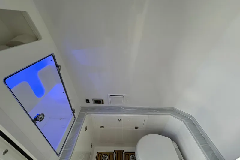  Yacht Photos Pics 2023 HCB 39 Speciale boat interior with modern bathroom and blue accent lighting.