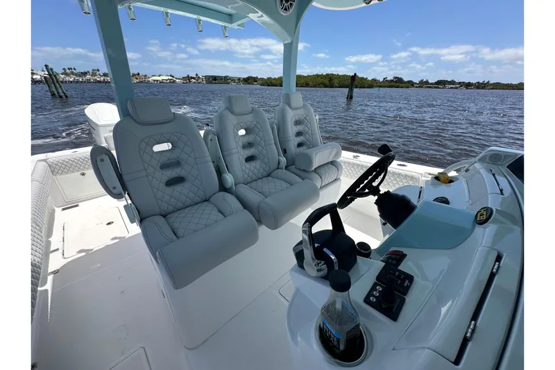  Yacht Photos Pics Luxurious 2023 HCB 39 Speciale boat interior with plush seating and modern controls.