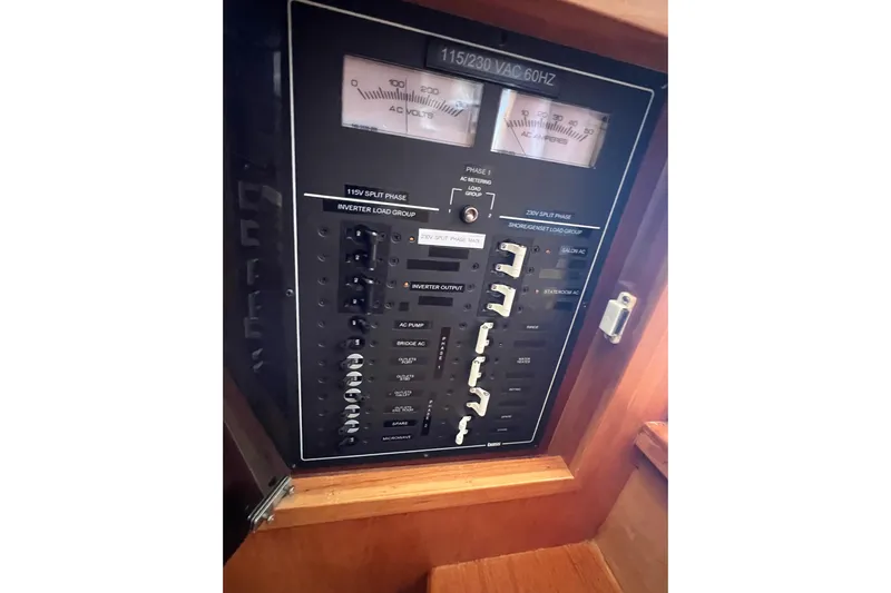  Yacht Photos Pics Electrical panel on a 2005 Sabre Flybridge boat, showing AC voltage and amperage meters.