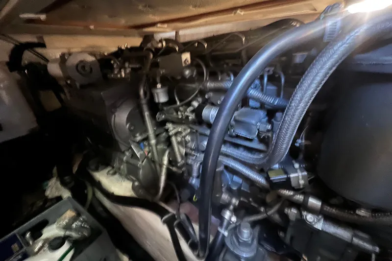  Yacht Photos Pics Engine compartment of a 2005 Sabre Flybridge boat, showcasing intricate mechanical components.