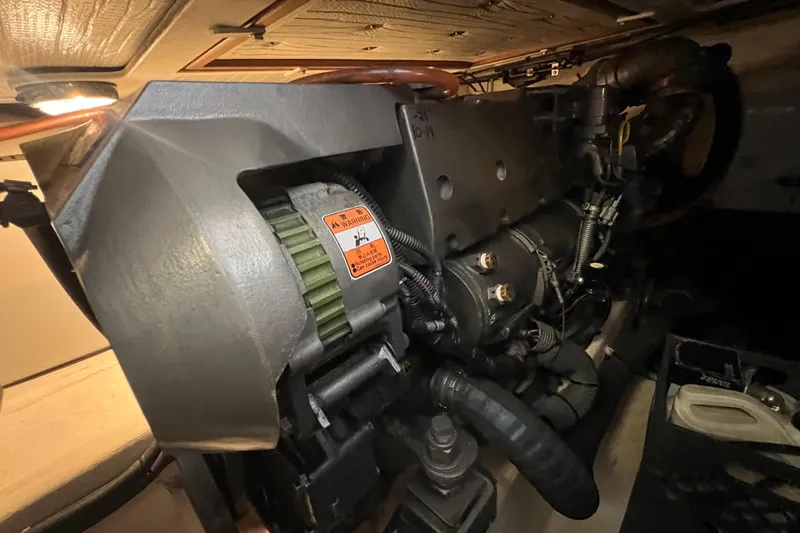  Yacht Photos Pics Engine compartment of a 2005 Sabre Flybridge boat, showcasing mechanical components and wiring.