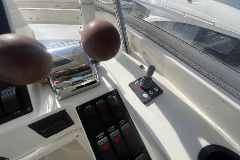  Yacht Photos Pics Control panel of a 2005 Sabre Flybridge boat with throttle and joystick.