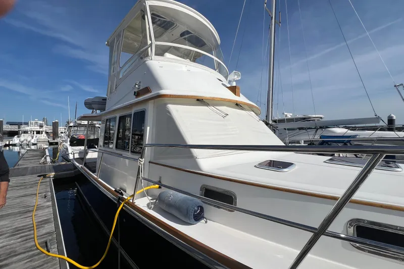  Yacht Photos Pics 2005 Sabre Flybridge yacht docked at marina under clear blue sky.