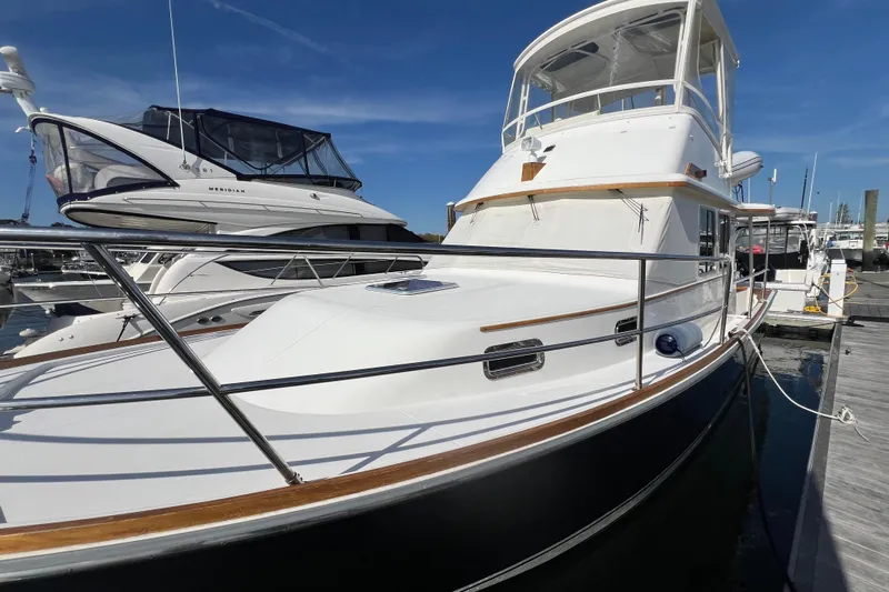  Yacht Photos Pics 2005 Sabre Flybridge yacht docked at marina under clear blue sky.