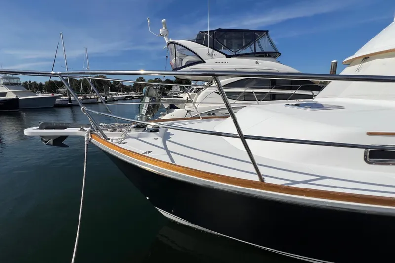  Yacht Photos Pics 2005 Sabre Flybridge yacht docked in marina under clear blue sky.