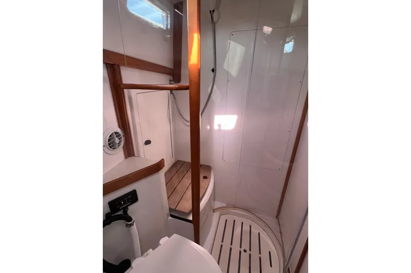  Yacht Photos Pics 2005 Sabre Flybridge bathroom with wooden accents and shower area.