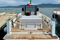 2008 Fjord 40' Open yacht docked, featuring spacious deck and Italian flag.