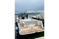 2008 Fjord 40' Open yacht docked, featuring spacious deck and seating area.