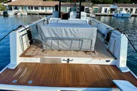 2008 Fjord 40' Open yacht with teak deck, docked at marina.