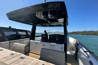 2008 Fjord 40' Open yacht with sleek design, spacious deck, and scenic ocean backdrop.