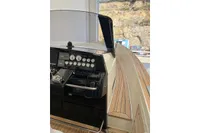 Control panel of a 2008 Fjord 40' Open yacht with wooden deck.