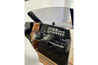 Control panel of 2008 Fjord 40' Open yacht with steering wheel and gauges.