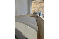 2008 Fjord 40' Open yacht interior with cushioned seating and wooden deck.