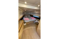 Luxurious cabin interior of 2008 Fjord 40' Open yacht with cozy bed and modern design.
