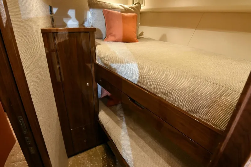  Yacht Photos Pics Bunk beds in 2019 Viking 80 Skybridge yacht cabin with wooden cabinetry.