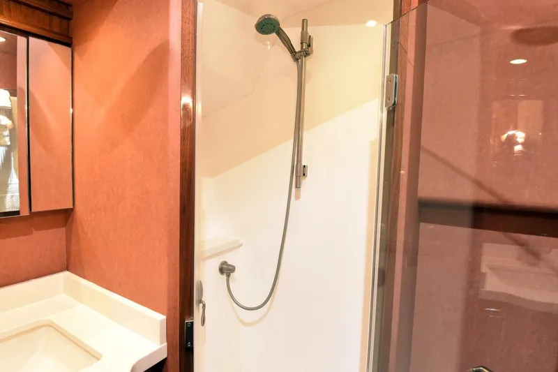  Yacht Photos Pics Luxurious bathroom in 2019 Viking 80 Skybridge yacht with modern shower and elegant design.