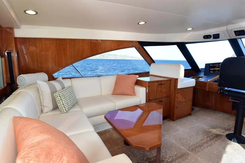  Yacht Photos Pics Luxurious interior of 2019 Viking 80 Skybridge yacht with ocean view.