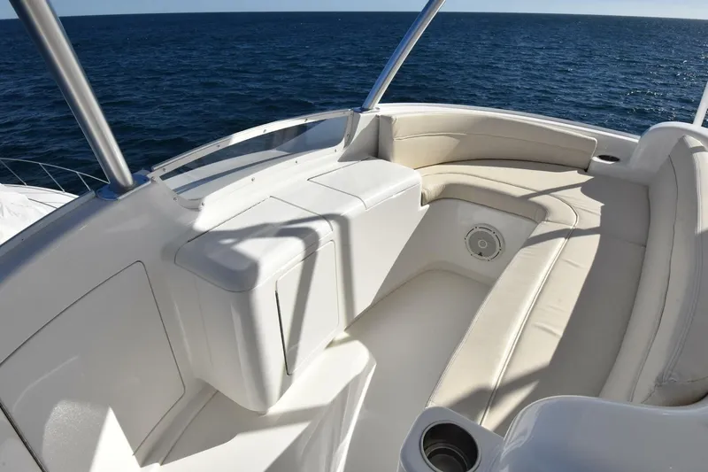  Yacht Photos Pics 2019 Viking 80 Skybridge yacht with luxurious seating overlooking the ocean.