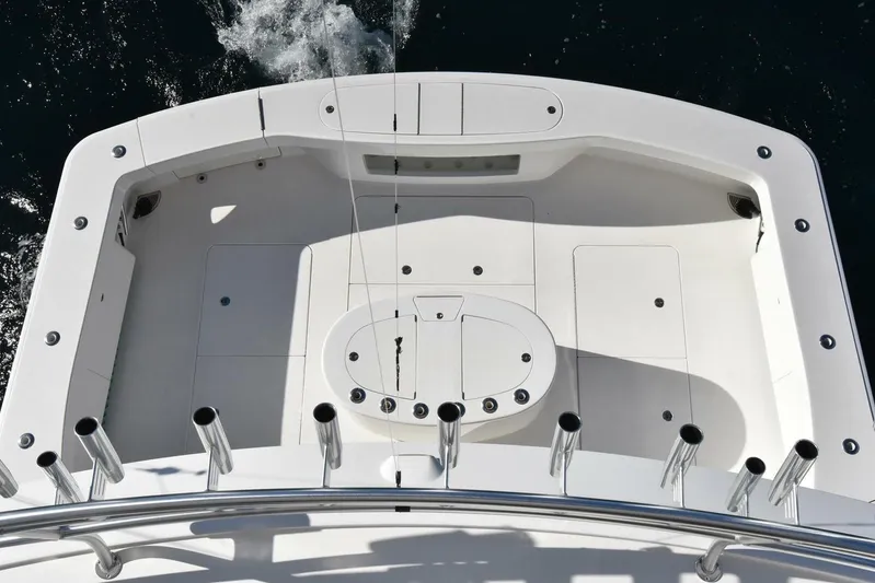  Yacht Photos Pics 2019 Viking 80 Skybridge yacht deck with rod holders and storage compartments.