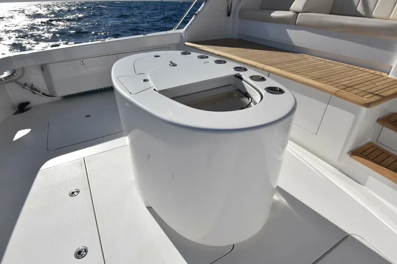  Yacht Photos Pics Luxury deck of 2019 Viking 80 Skybridge yacht with seating and ocean view.