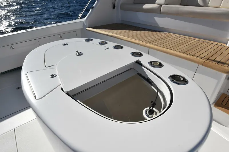  Yacht Photos Pics 2019 Viking 80 Skybridge yacht deck with seating and fishing station.