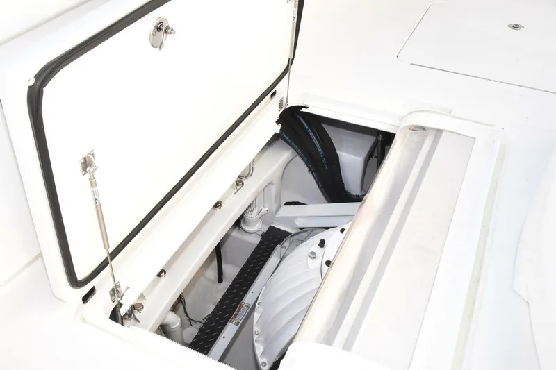  Yacht Photos Pics Open hatch of 2019 Viking 80 Skybridge yacht, revealing interior mechanical components.