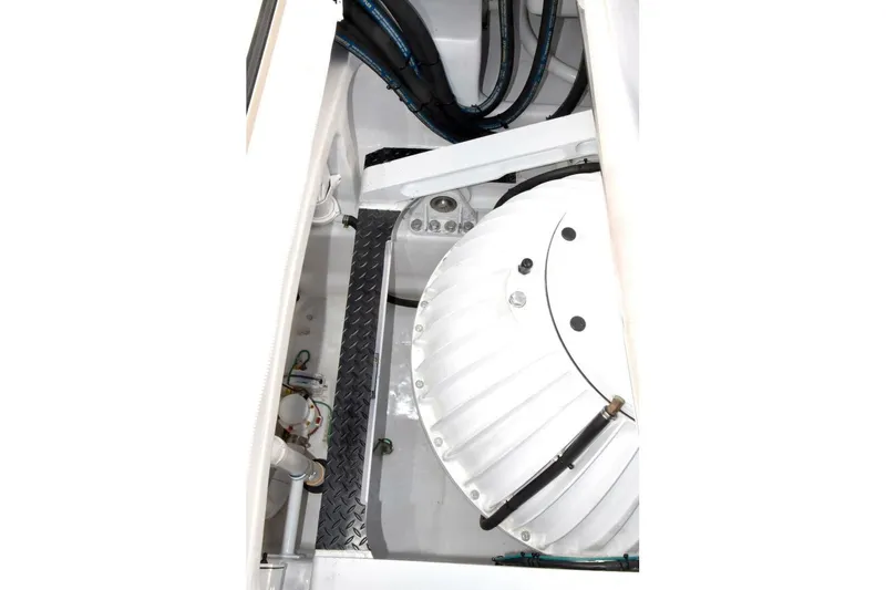  Yacht Photos Pics Engine compartment of 2019 Viking 80 Skybridge yacht, showcasing mechanical components and wiring.