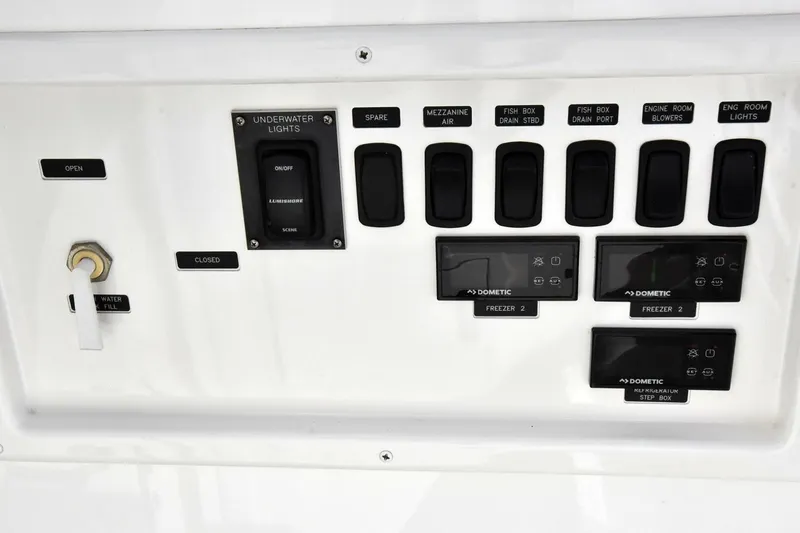  Yacht Photos Pics Control panel of a 2019 Viking 80 Skybridge yacht with switches and displays.