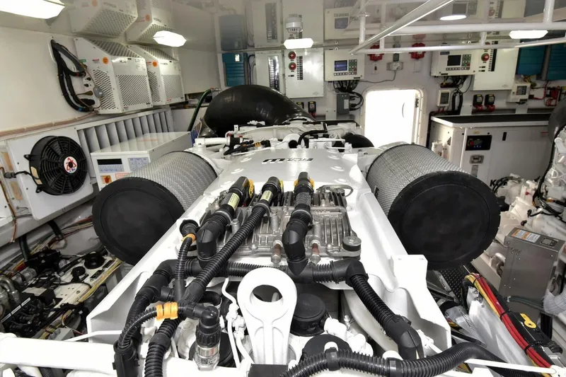  Yacht Photos Pics Engine room of 2019 Viking 80 Skybridge yacht, showcasing advanced machinery and components.
