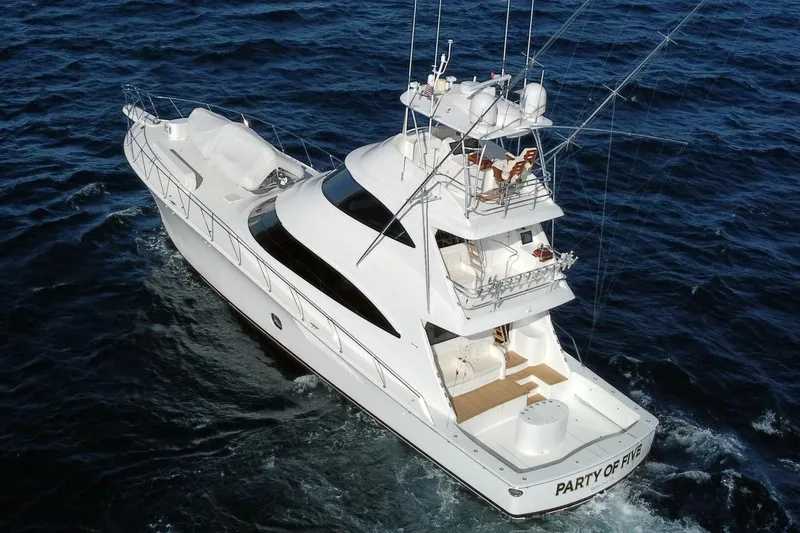  Yacht Photos Pics 2019 Viking 80 Skybridge yacht cruising on open sea, aerial view.