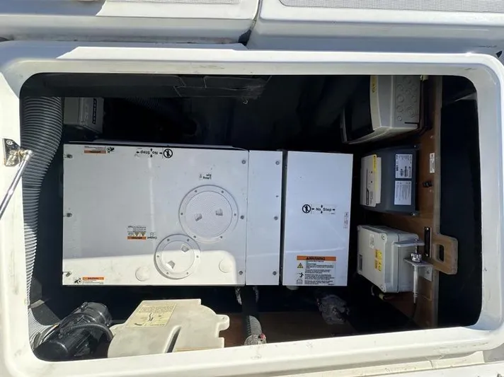 Tranquillity Yacht Photos Pics Engine compartment of a 2022 Excess 15 boat, featuring mechanical and electrical components.