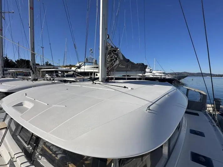 Tranquillity Yacht Photos Pics 2022 Excess 15 catamaran docked at marina under clear blue sky.