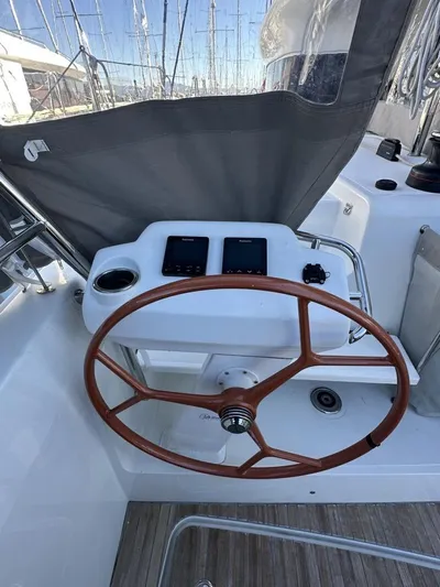 Tranquillity Yacht Photos Pics Steering wheel of a 2022 Excess 15 yacht with navigation instruments.