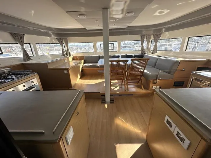 Tranquillity Yacht Photos Pics Luxurious interior of 2022 Excess 15 yacht with modern kitchen and seating area.