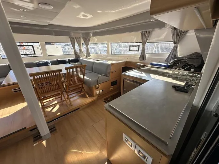 Tranquillity Yacht Photos Pics Luxurious interior of 2022 Excess 15 yacht with modern kitchen and dining area.