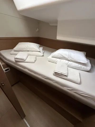 Tranquillity Yacht Photos Pics Cozy cabin interior of 2022 Excess 15 yacht with neatly arranged bedding.
