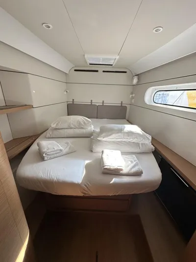Tranquillity Yacht Photos Pics Luxurious cabin interior of 2022 Excess 15 yacht with neatly arranged bedding.