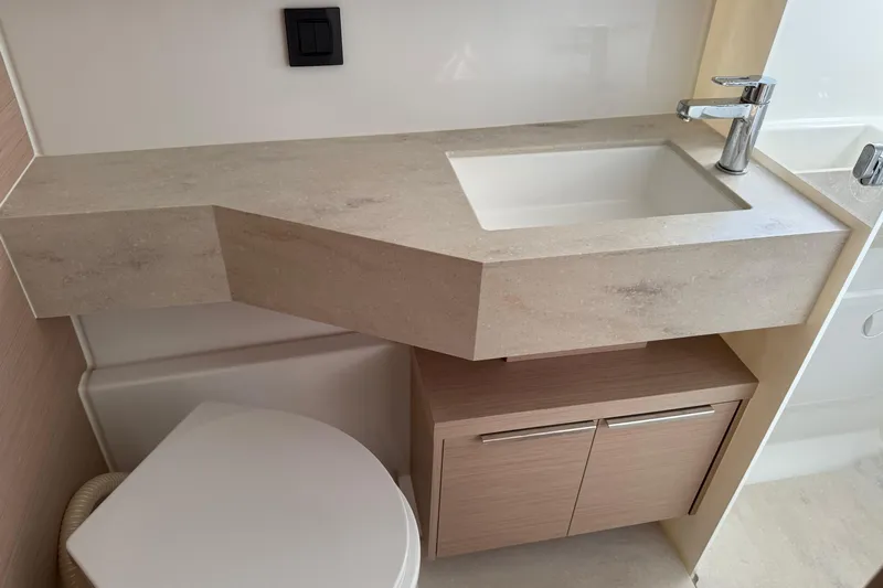  Yacht Photos Pics Modern bathroom sink and cabinet in 2022 Lagoon 46 yacht.