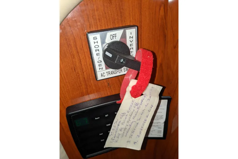Lottie-da Yacht Photos Pics AC transfer switch on 2004 Sea Ray 380 Sundancer with handwritten note attached.