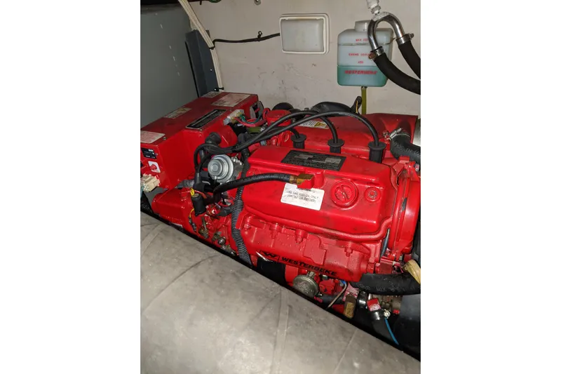 Lottie-da Yacht Photos Pics Engine compartment of a 2004 Sea Ray 380 Sundancer with red Westerbeke generator.