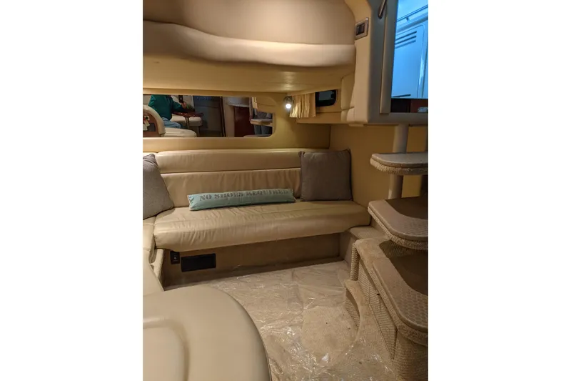 Lottie-da Yacht Photos Pics Interior of 2004 Sea Ray 380 Sundancer with beige seating and cozy decor.