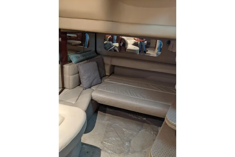 Lottie-da Yacht Photos Pics 2004 Sea Ray 380 Sundancer interior with beige seating and cushions.