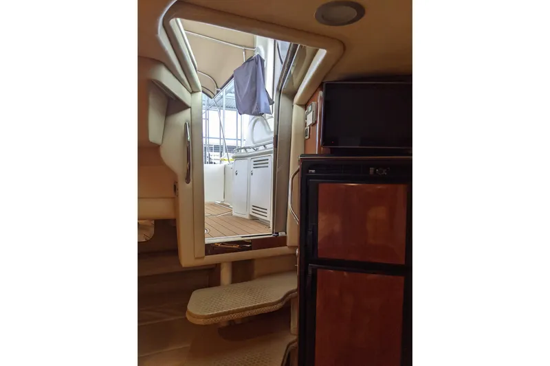 Lottie-da Yacht Photos Pics Interior view of 2004 Sea Ray 380 Sundancer yacht, showing steps and cabin amenities.