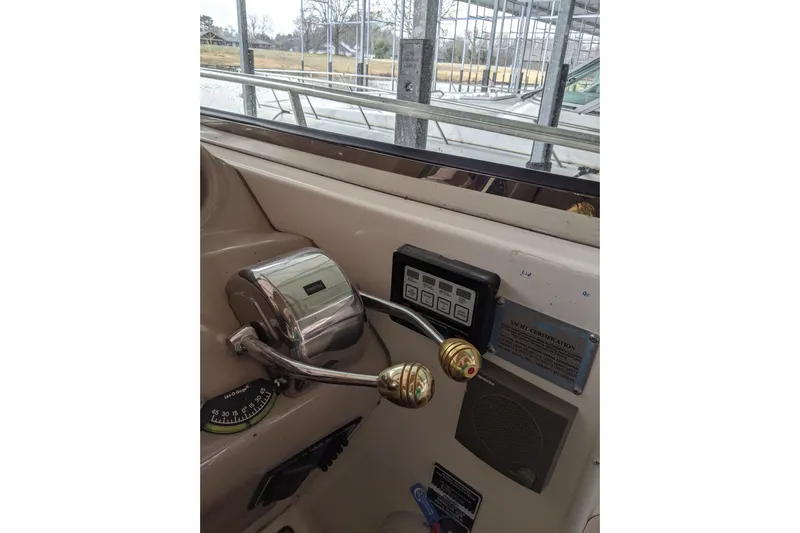 Lottie-da Yacht Photos Pics Control panel of 2004 Sea Ray 380 Sundancer yacht with throttle and navigation instruments.