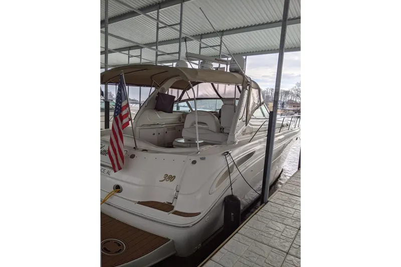 Lottie-da Yacht Photos Pics 2004 Sea Ray 380 Sundancer yacht docked under a covered marina.