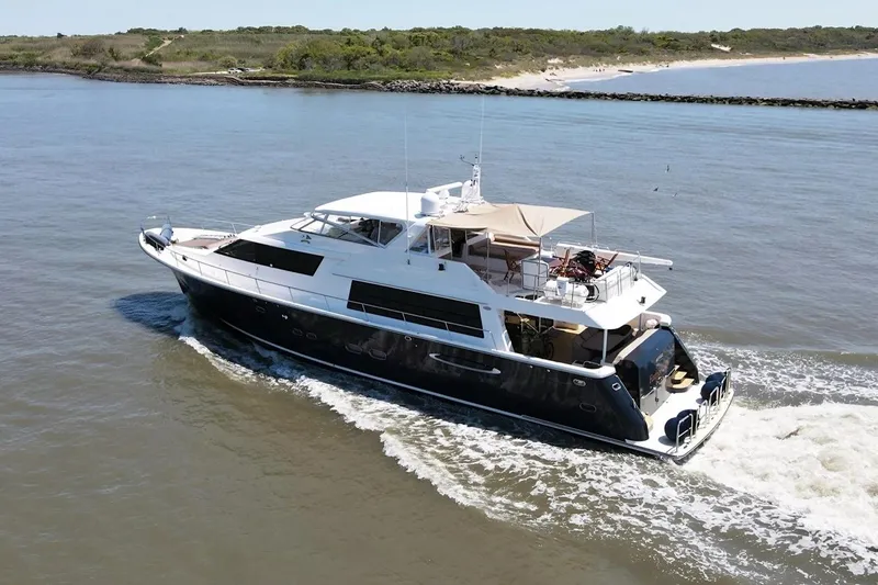 Harbor Lady Yacht Photos Pics 2005 Pacific Mariner Raised Pilothouse Motor Yacht cruising on open water.