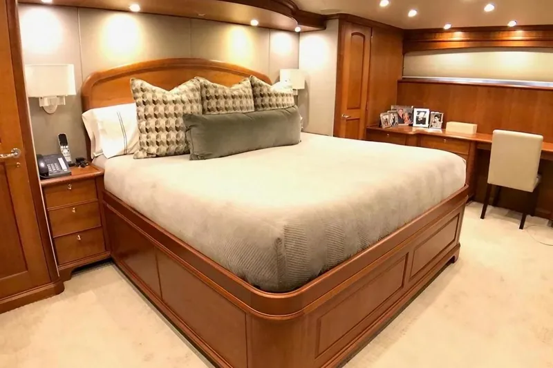 Harbor Lady Yacht Photos Pics Luxurious bedroom in 2005 Pacific Mariner Raised Pilothouse Motor Yacht with elegant wood furnishings.