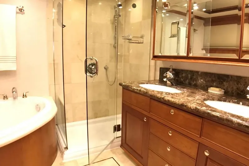 Harbor Lady Yacht Photos Pics Luxurious bathroom in 2005 Pacific Mariner yacht with dual sinks and glass shower.