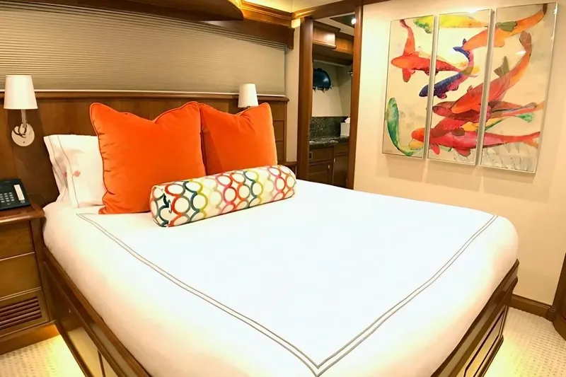 Harbor Lady Yacht Photos Pics Luxurious bedroom in 2005 Pacific Mariner Raised Pilothouse Motor Yacht with vibrant decor.